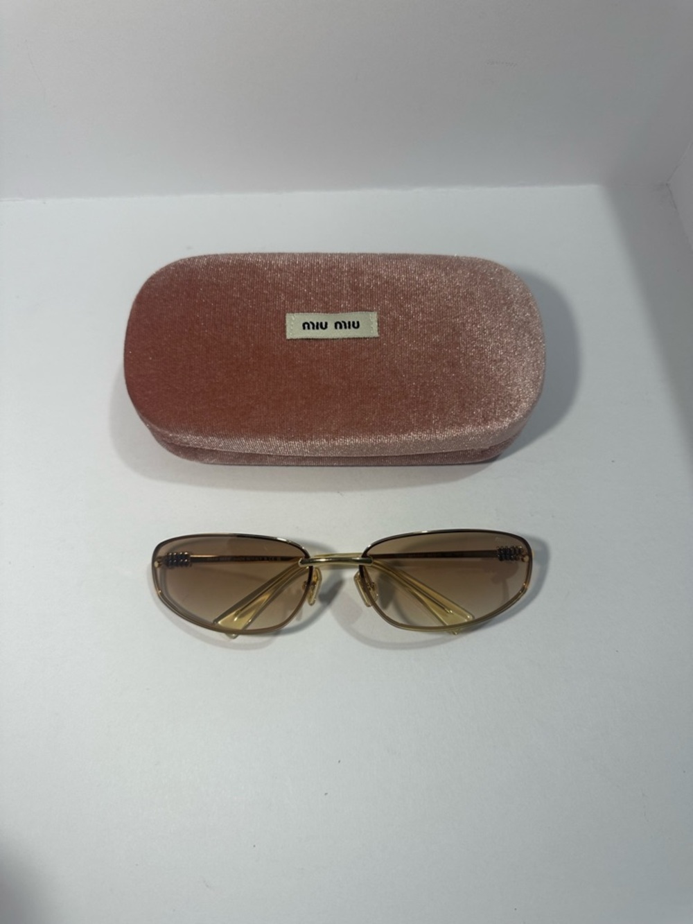 Miu Miu gold gradient sunglasses with pink case